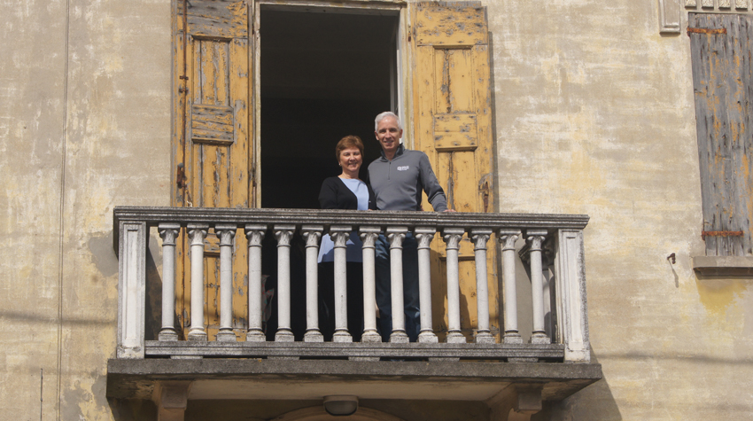 Author and brother on the balcony of building owned by their great grandparents, Dodici Morelli, Italy