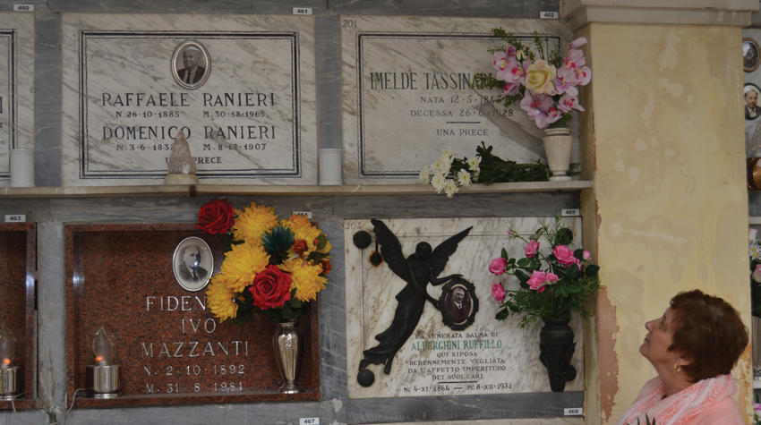Author at the tombs of her great grandfather and great, great grandparents, Renazzo, Italy